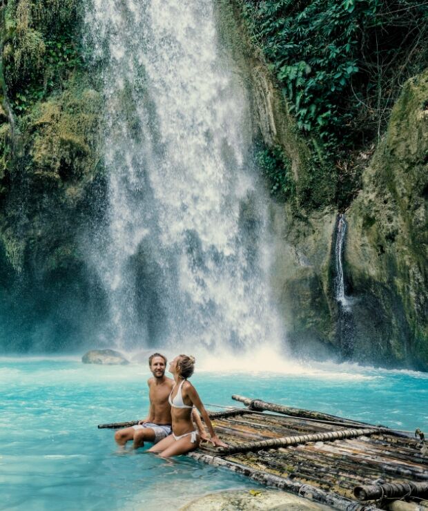 couple under waterfall